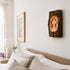 Wooden wall art piece above a bed in a bedroom setting