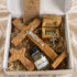 Gift set inside open box: wooden cross, rosary, Holy Water bottle, authenticity certificate