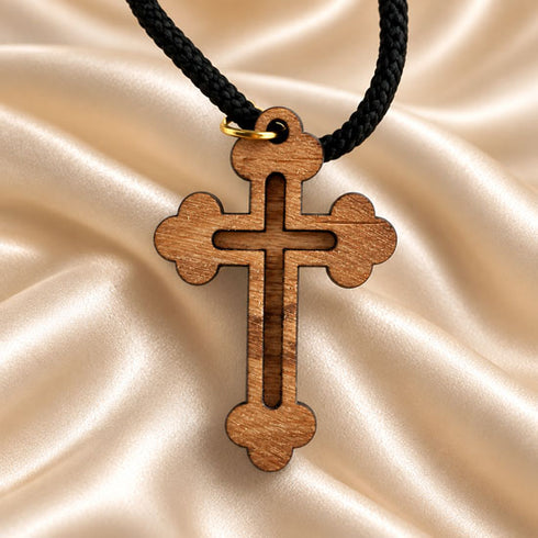 Olive wood cross pendant necklace with black cord and gold-tone loop