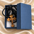 Olive wood cross pendant in blue gift box with black braided necklace cord
