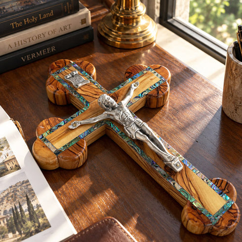 Detailed view of olive wood budded crucifix with abalone Stations of the Cross