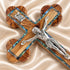 Close view of the corpus on an olive wood budded crucifix with abalone inlay