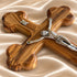 Close-up of the olive wood budded standing crucifix showing its carved details