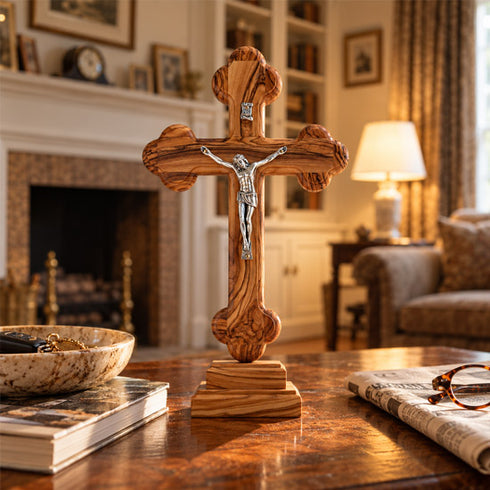 Bethlehem olive wood budded standing crucifix displayed in a living room