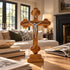 Budded standing olive wood crucifix displayed on a table