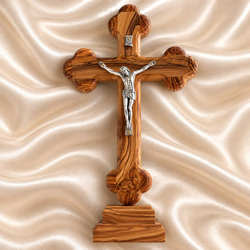 Budded standing crucifix made of olive wood from Bethlehem, showing the crucified Christ