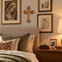 Bethlehem olive wood budded wall cross displayed in a bedroom