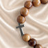 Olive wood bead bracelet with silver-tone cross charm