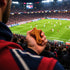 Person holding a comfort cross at a soccer stadium