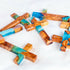 Various handcrafted olive wood crosses with blue and green epoxy, finely polished and displayed on a white background.