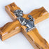A close up on a handmade olive wood cross for Girl Communion on a white background.