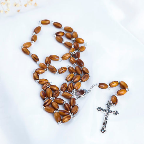 Oval bead olive wood rosary with Holy Soil
