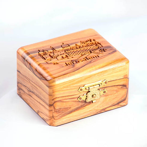 Olive wood box with Jerusalem engraving on the lid, placed on white background
