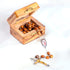 Olive wood rosary with silver ands gold colour crucifix featuring Virgin Mary's icon, placed inside an olive wood box.
