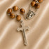 Olive wood praying beads with a silver cross and Jerusalem written on it