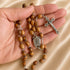 Olive wood rosary with Holy Water centerpiece and INRI crucifix handheld.