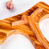 A close up image of a handmade olive wood tau cross, also known as Saint Anthony's Cross, with modern crucifix design displayed on a white background.