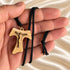 Tau crucifix necklace close-up: olive wood pendant on black braided cord