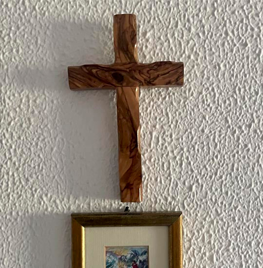 Large thorn cross handmade from Bethlehem olive wood, hanging on the wall.