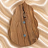 Back view of Our Lady of Guadalupe olive wood holy water font showing the natural wood grain and hanger