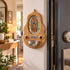 Our Lady of Guadalupe olive wood holy water font displayed beside a doorway in a warm home interior