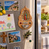 Our Lady of Guadalupe olive wood holy water font displayed on a freezer in a bright kitchen setting