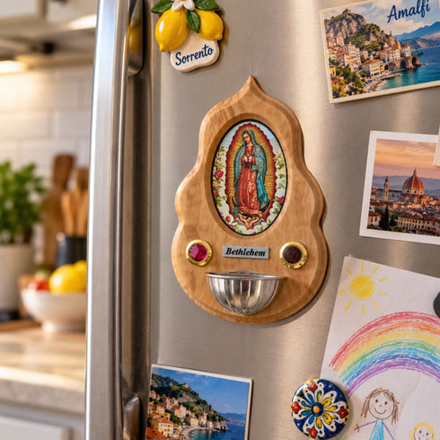 Our Lady of Guadalupe olive wood holy water font attached to a refrigerator in a lived-in kitchen