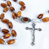 Oval bead olive wood rosary with Holy Soil