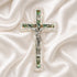 Frontal image of a classic olive wood Latin cross featuring silver crucifix and Mother of Pearl inlay detail on soft white surface.