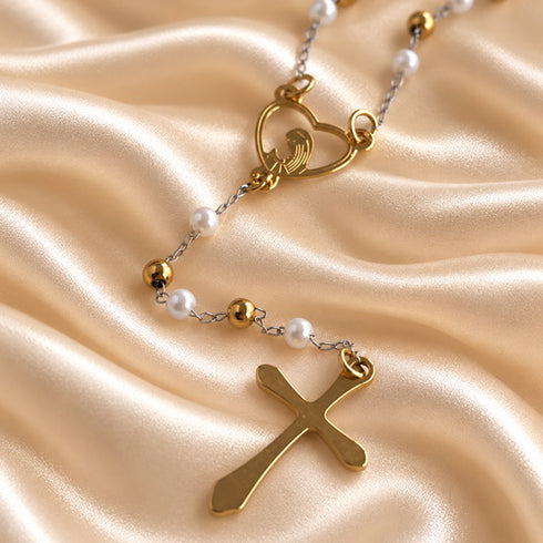 White pearl rosary displayed in a full-length arrangement with gold-tone chain and crucifix