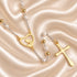 White pearl rosary with gold-tone chain and crucifix displayed in a softly styled devotional setting