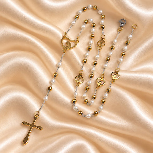 White pearl rosary with gold-tone chain, Marian centerpiece and crucifix on a neutral background