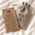 Piece of Holy Land certificate of authenticity with cotton pouch.