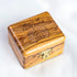 Arial shot of a closed, medium size, olive wood box with Piece of Holy Land logo engraved on it.