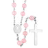 Pink bead rosary with silver cross on a white background