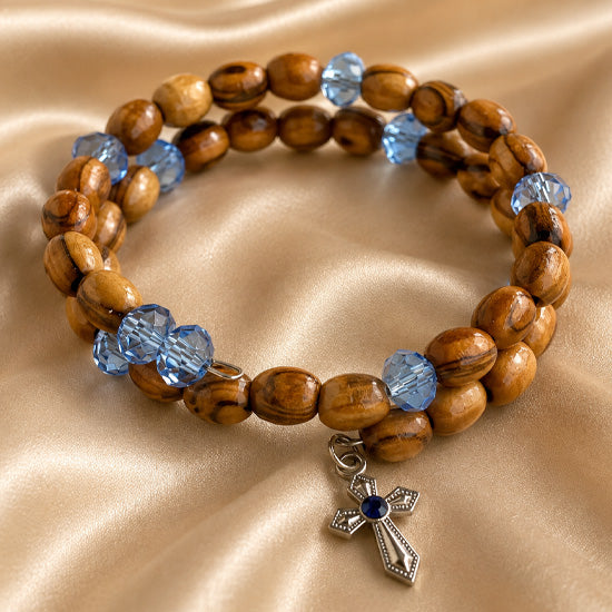 Olive wood wrap bracelet with blue crystal beads and dangling cross charm
