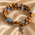 Olive wood wrap bracelet with blue crystal beads and dangling cross charm