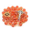 Red glass bead rosary with gold accents and St Benedict crucifix on a white background.