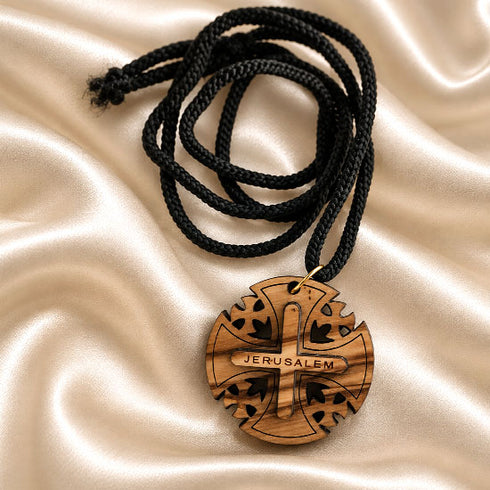 Round wooden Jerusalem cross pendant necklace on black braided cord