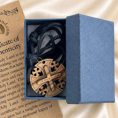Gift box with round wooden Jerusalem cross pendant necklace and black cord inside