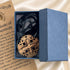 Gift box with round wooden Jerusalem cross pendant necklace and black cord inside