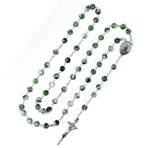 Green and white St.Jude rosary with a cross on a white background