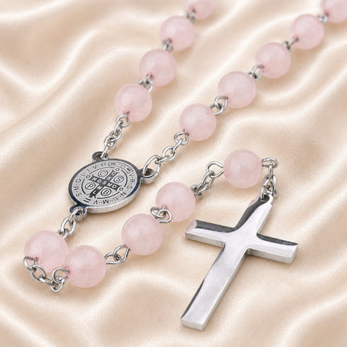 Pink jade rosary close-up with St. Benedict medal and silver cross links