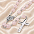 Pink jade rosary close-up with St. Benedict medal and silver cross links