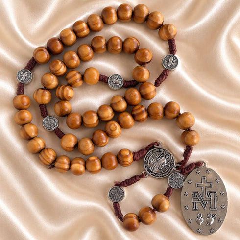 Saint Benedict and Miraculous Medal olive wood rosary shown in a detailed product view