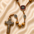 Olive wood prayer beads with St. Benedict medal centerpiece and silver crucifix.