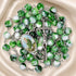A green and white marbled rosary with a metal crucifix and an oval medallion, on a cream satin background.