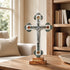 Budded decorative cross on a table in a sunny living room