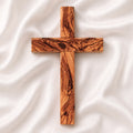 Handmade olive wood Thorn cross from Bethlehem on white surface