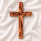 Handmade olive wood Thorn cross from Bethlehem on white surface